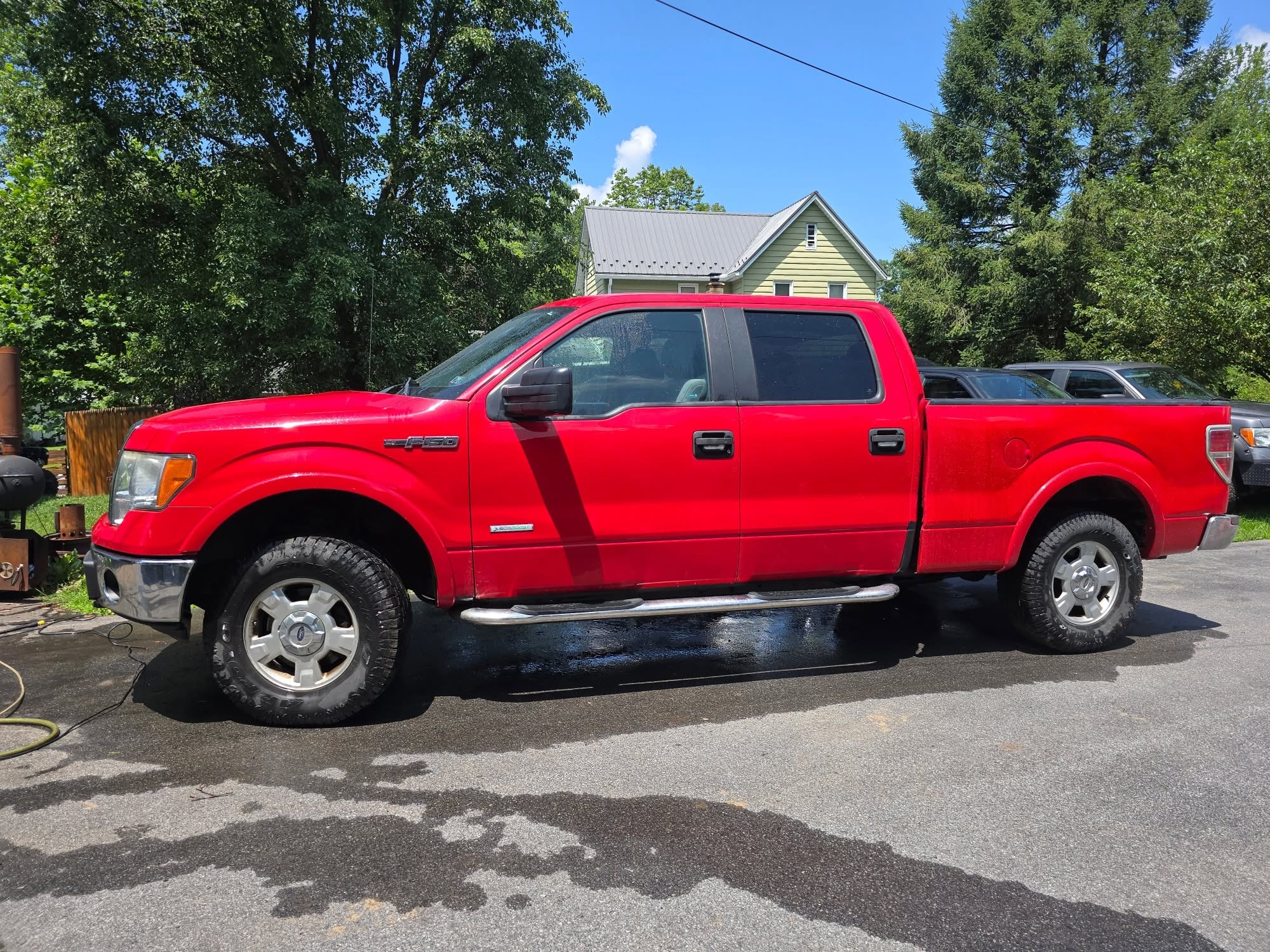 Red pickup after the bedside rust repair was completed